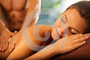 Woman relaxing in a spa salon