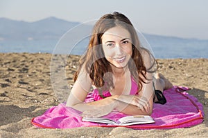 Woman relaxing and sunbathing on the beach