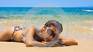 Woman relaxing on a tropical beach