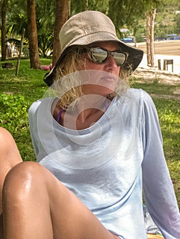 Woman relaxing on tropical shoreline