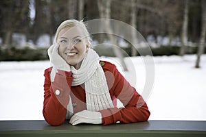 Woman relies at terrace boundary