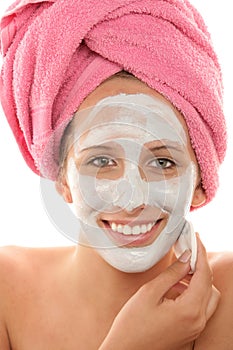 Woman removing facial mask