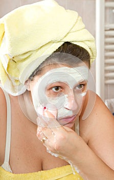Woman removing mask
