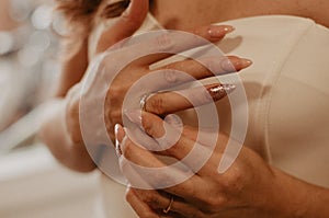 Woman removing the ring from the finger