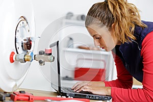 woman reparing boiler