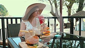 Woman at a resort restaurant on a beach vacation