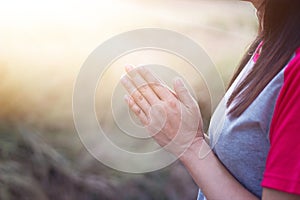 Woman respect and pray on nature background