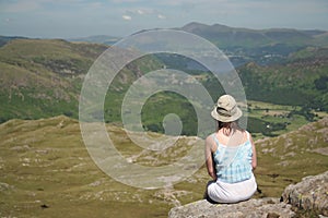 Woman at rest in Lake District,focus on woman