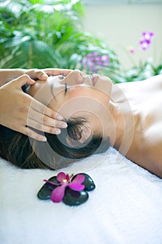 Woman restful while being in head massage