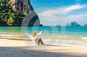 Woman resting on Railay beach Krabi Thailand. Asia