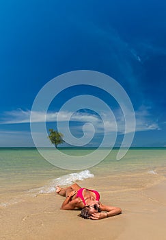 Woman resting on the beach at Klong muang Thailand