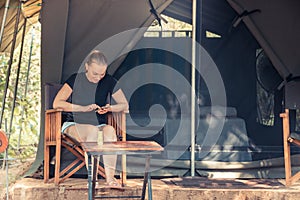 Woman resting in camping during her travelling concept travel lifestyle and eco tourism