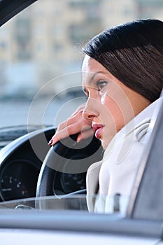 Woman is resting in a car