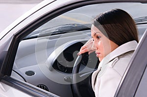 Woman is resting in a car