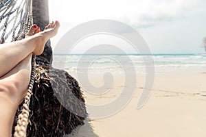 Woman Resting in a Hammock on a Tropical Background. Sea and Rest. Journey. Holiday