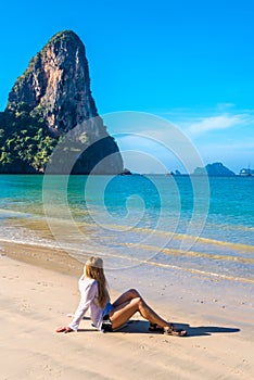 Woman resting on Railay beach Krabi Thailand. Asia