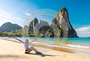 Woman resting on Railay beach Krabi Thailand. Asia