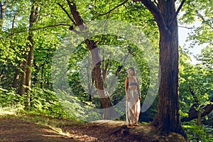 Woman resting after yoga in forest