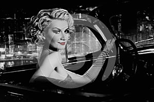 Woman in retro car against