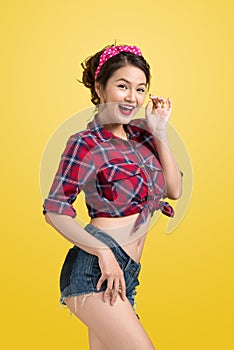 woman retro portrait with pin-up make-up and hairstyle pos