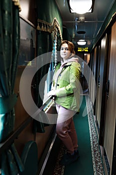 Woman in retro train carriage