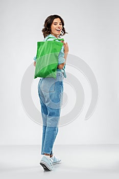 Woman with reusable canvas bag for food shopping