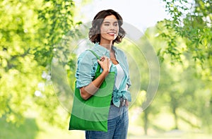Woman with reusable canvas bag for food shopping