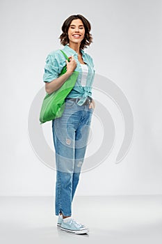 Woman with reusable canvas bag for food shopping