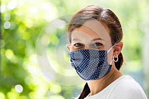 Woman In Reusable Cloth Face Mask