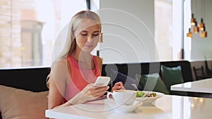 Woman or reviewer eating lunch at restaurant