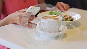 Woman or reviewer eating lunch at restaurant