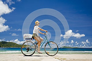 Woman ride along The Beach