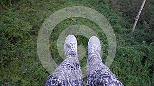 Woman ride a cable way car, aerial view