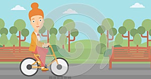 Woman riding bicycle.