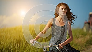 Woman riding bicycle in country