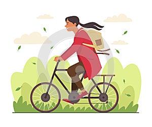 Woman Riding a Bicycle in Public Park