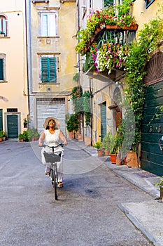 Woman Riding A Bike In Italy