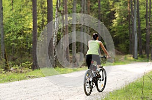 Woman riding bike outside