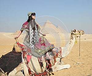 Woman riding camel