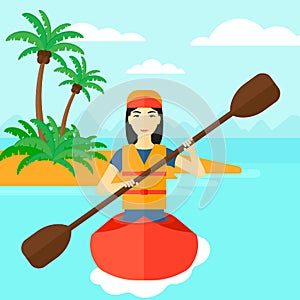 Woman riding in canoe.