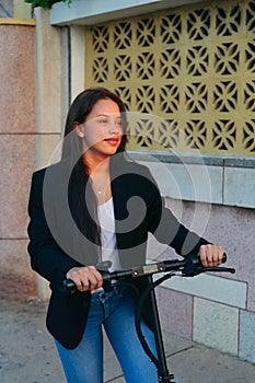 Woman Riding Electric Scooter On Paving