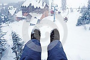Woman riding funicular in winter mountains, on ski resort photo