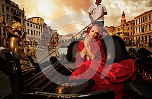 Woman riding gondola on Venice canal