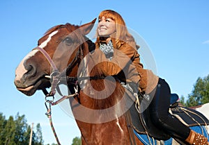 A woman riding a horse