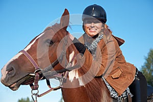 A woman riding a horse