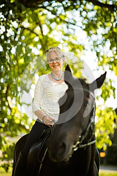 Woman riding a horse. Equestrian sport