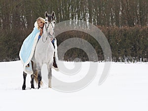 Woman Riding Horse in the Snow