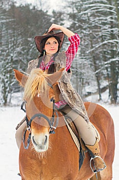 Woman Riding a Horse the Snow