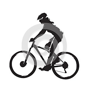 Woman riding mountain bike, side view