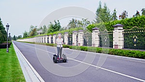 Woman riding towards the camera on a Segway